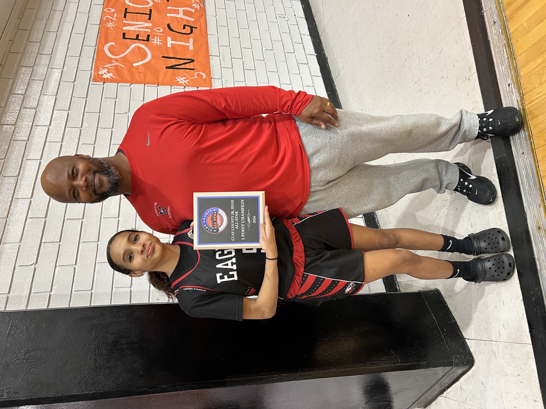 Run & Shoot coach with a young athlete